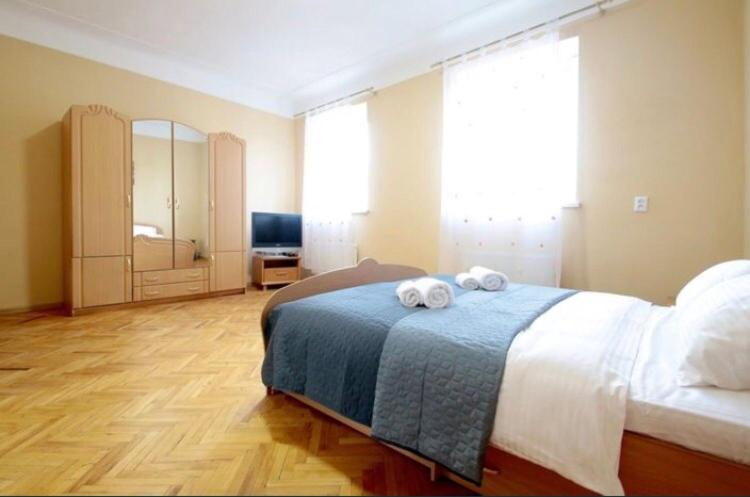 Кровать или кровати в номере Apartment Armenian Cathedral
