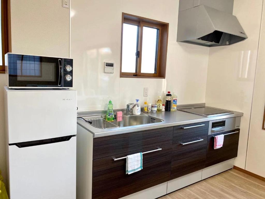 Kuchyň nebo kuchyňský kout v ubytování 富士晴 Guest House