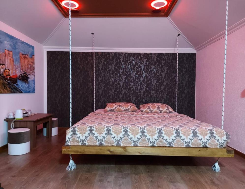 Tempat tidur dalam kamar di SECRET Apartments