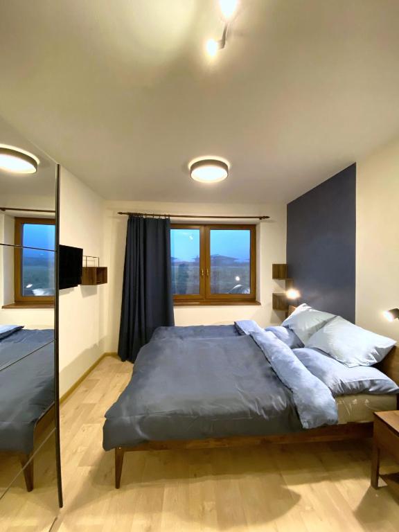 Postel nebo postele na pokoji v ubytování Panorama Home Valča