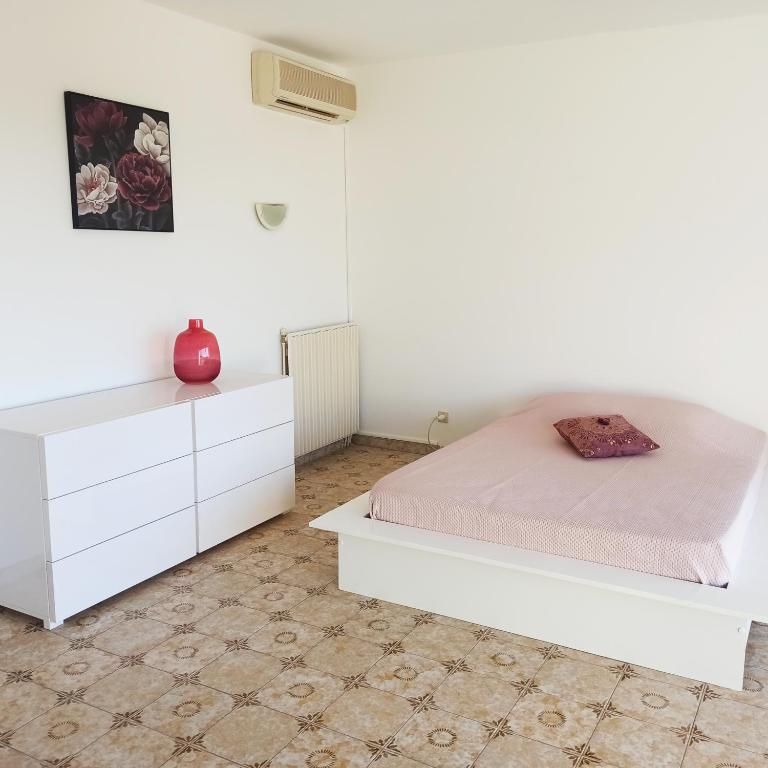 Postel nebo postele na pokoji v ubytování U Riniccio