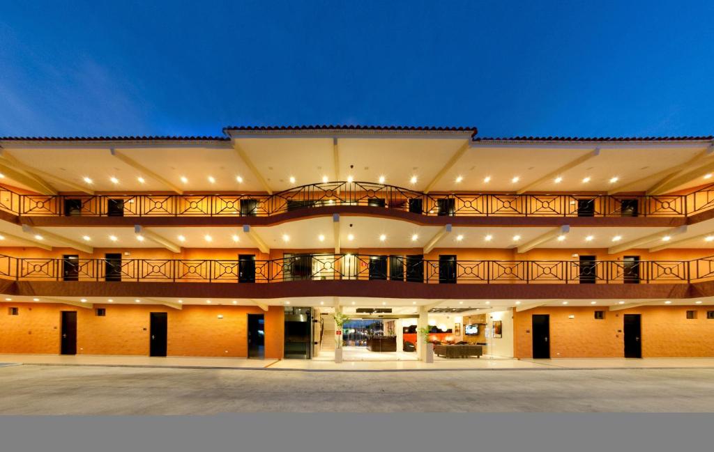 an exterior view of a building at night at The Beach House in Panama City