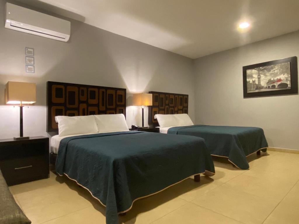 Postel nebo postele na pokoji v ubytování Hotel Boutique Boca - Veracruz