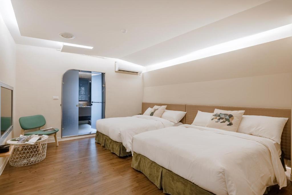 Postel nebo postele na pokoji v ubytování Ya Nold Hot Spring Hotel