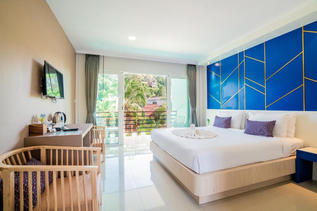 Rúm í herbergi á Phi Phi Anita Resort
