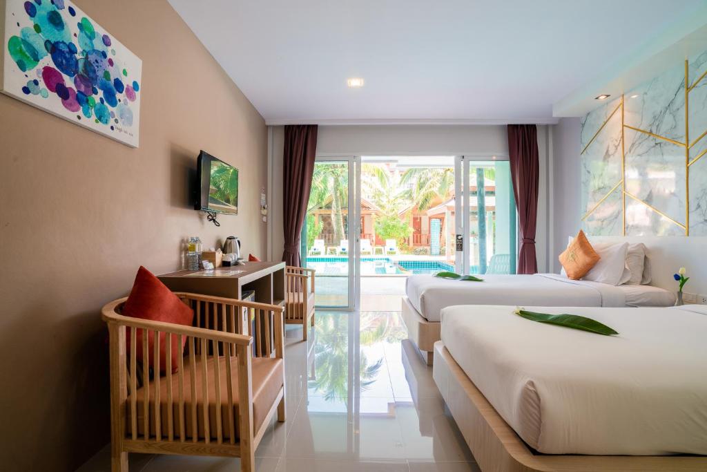 Rúm í herbergi á Phi Phi Anita Resort