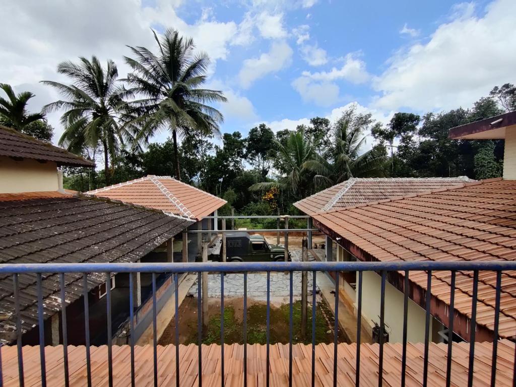 a view of the roofs of two houses at Hanakodu homestay in Sringeri