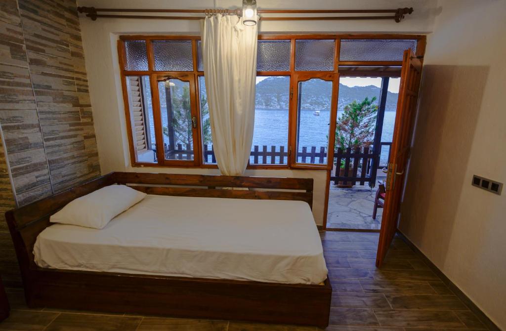 Postel nebo postele na pokoji v ubytování Ankh Pension