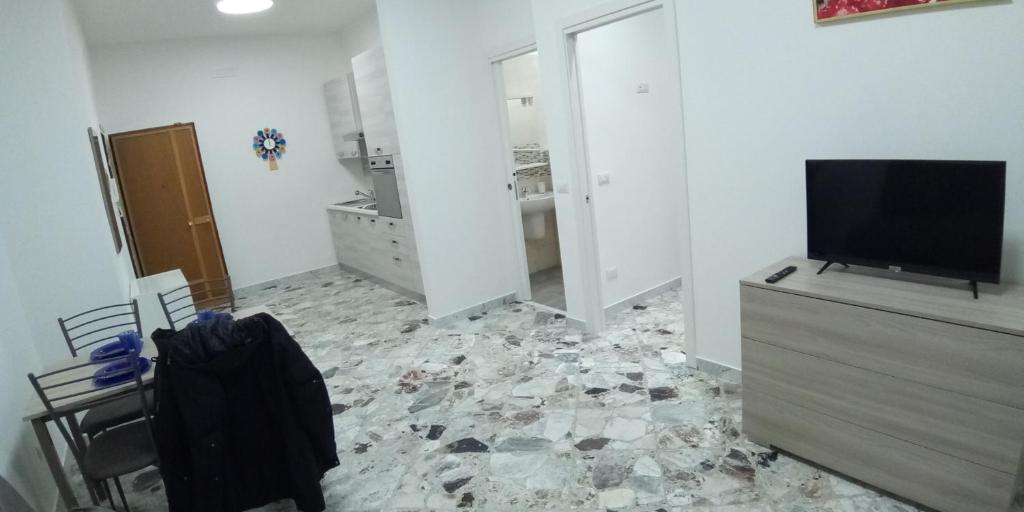 Televízia a/alebo spoločenská miestnosť v ubytovaní Station suite
