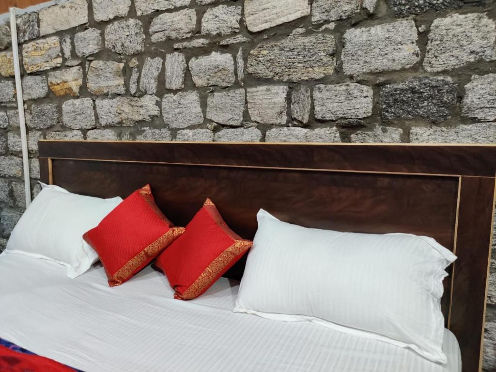 Postel nebo postele na pokoji v ubytování Stone Huts
