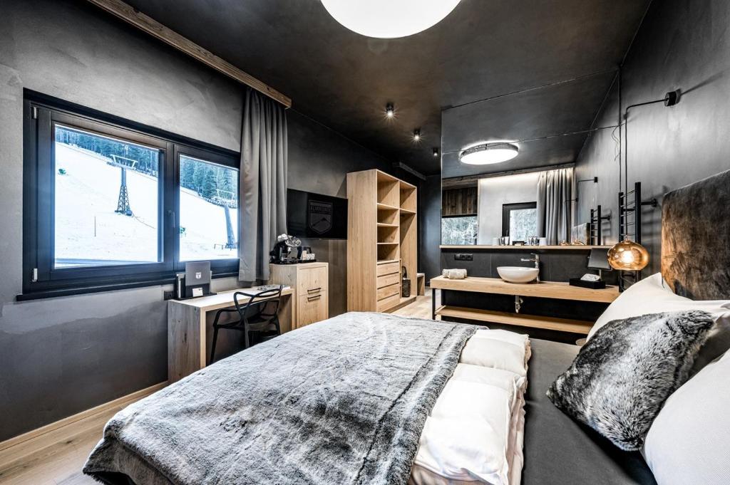Postel nebo postele na pokoji v ubytování ALMMONTE PRÄCLARUM SUITES Design Hotel