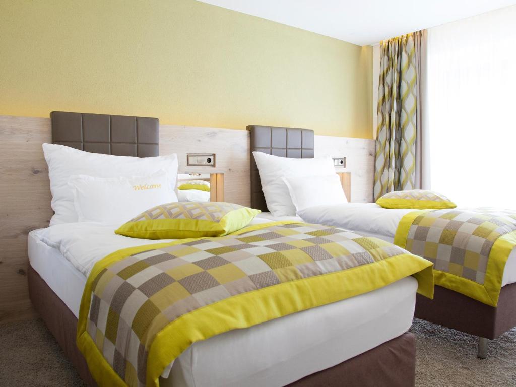 Postel nebo postele na pokoji v ubytování Hotel Neder