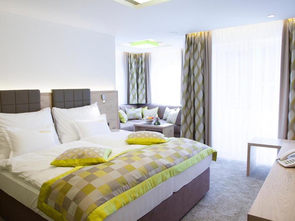 Postel nebo postele na pokoji v ubytování Hotel Neder
