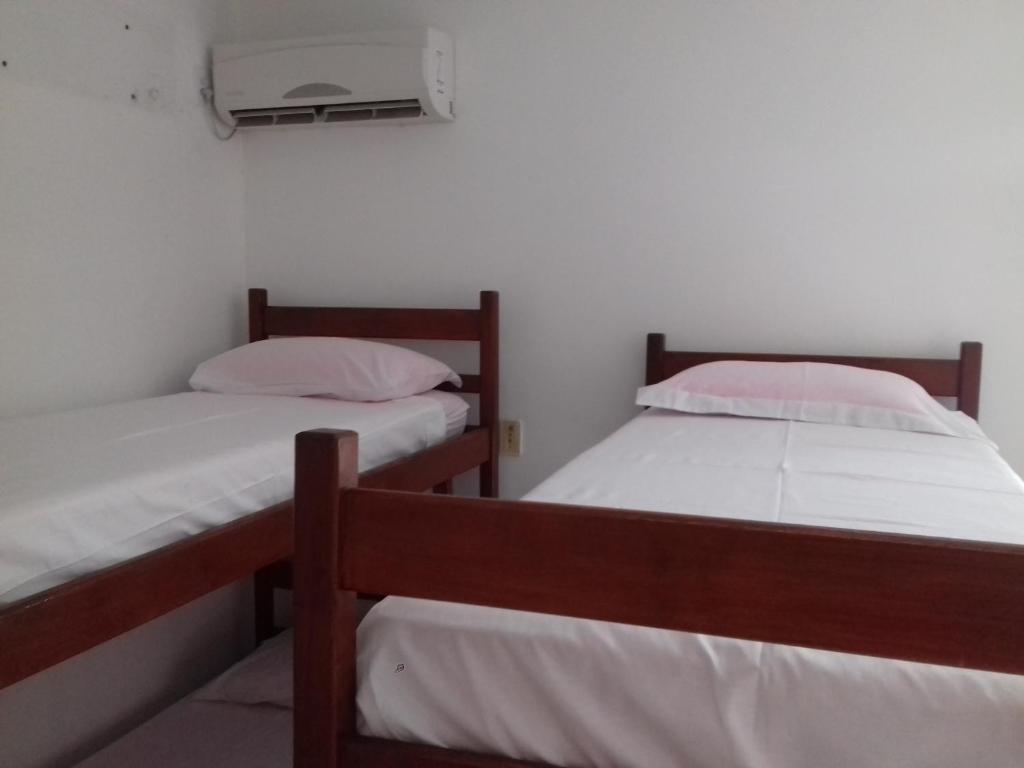Cama o camas de una habitación en Pousada e Restaurante Recanto do Porto