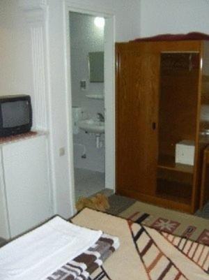 Postel nebo postele na pokoji v ubytování Hotel Anadolu