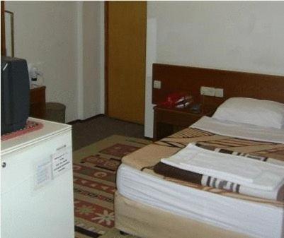 Postel nebo postele na pokoji v ubytování Hotel Anadolu