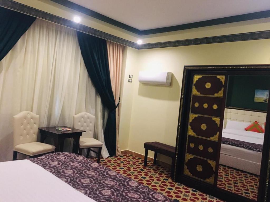 Postel nebo postele na pokoji v ubytování Omar Elkhaiam Hotel