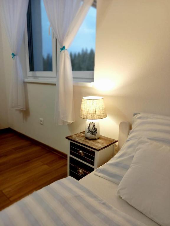 Postel nebo postele na pokoji v ubytování Apartmán pod Sivým vrchom