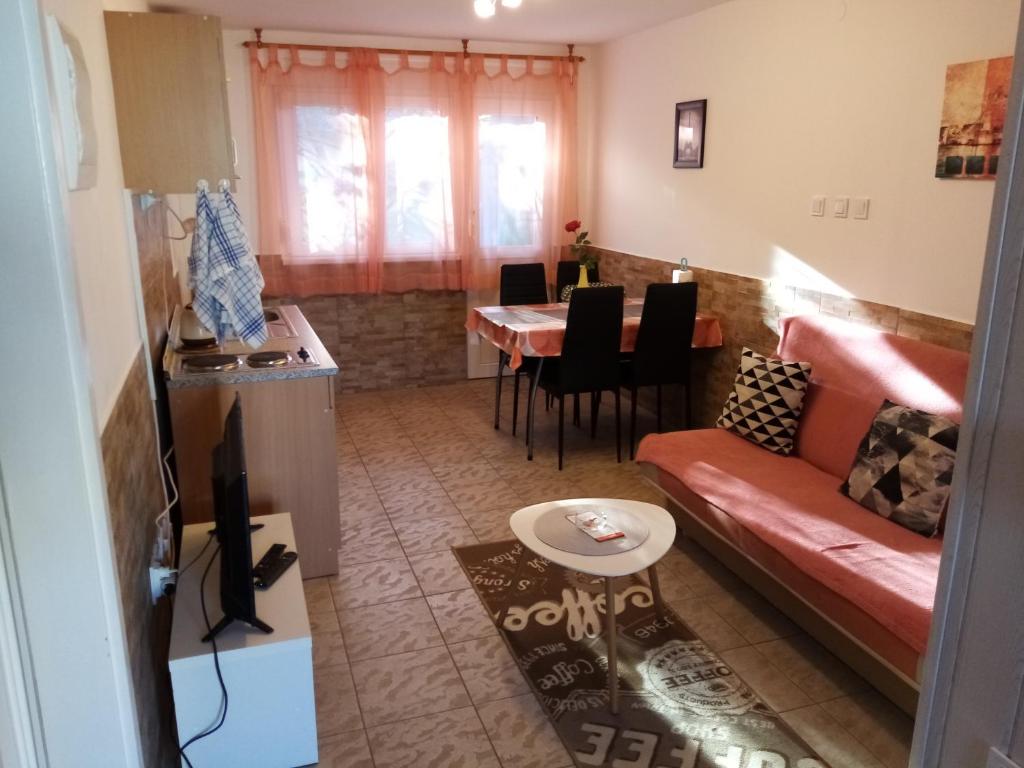 a living room with a couch and a table at Apartment Buic in Pula