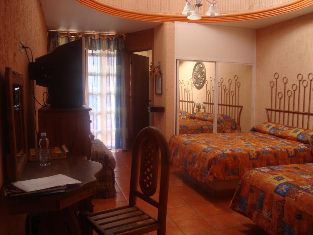 Katil atau katil-katil dalam bilik di Hotel Villa Manzanares