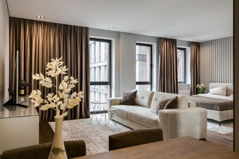 a living room with a couch and a table at Classy Studio in Chicago, a Luxurious Condo in Kyiv