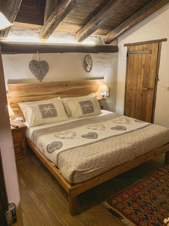 Łóżko lub łóżka w pokoju w obiekcie Locanda Allevè Hotel Ristorante