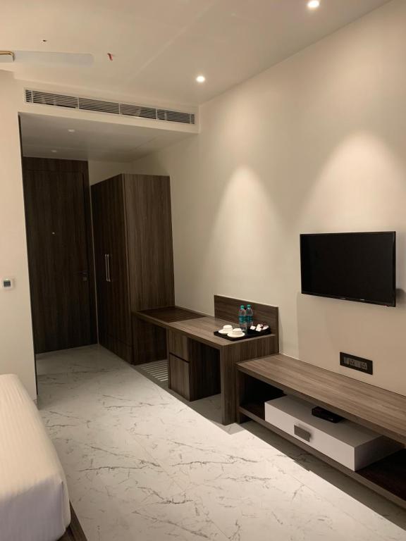 TV a/nebo společenská místnost v ubytování ECONEST HOTEL