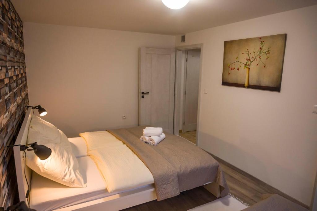 Postel nebo postele na pokoji v ubytování Apartmány Habovka