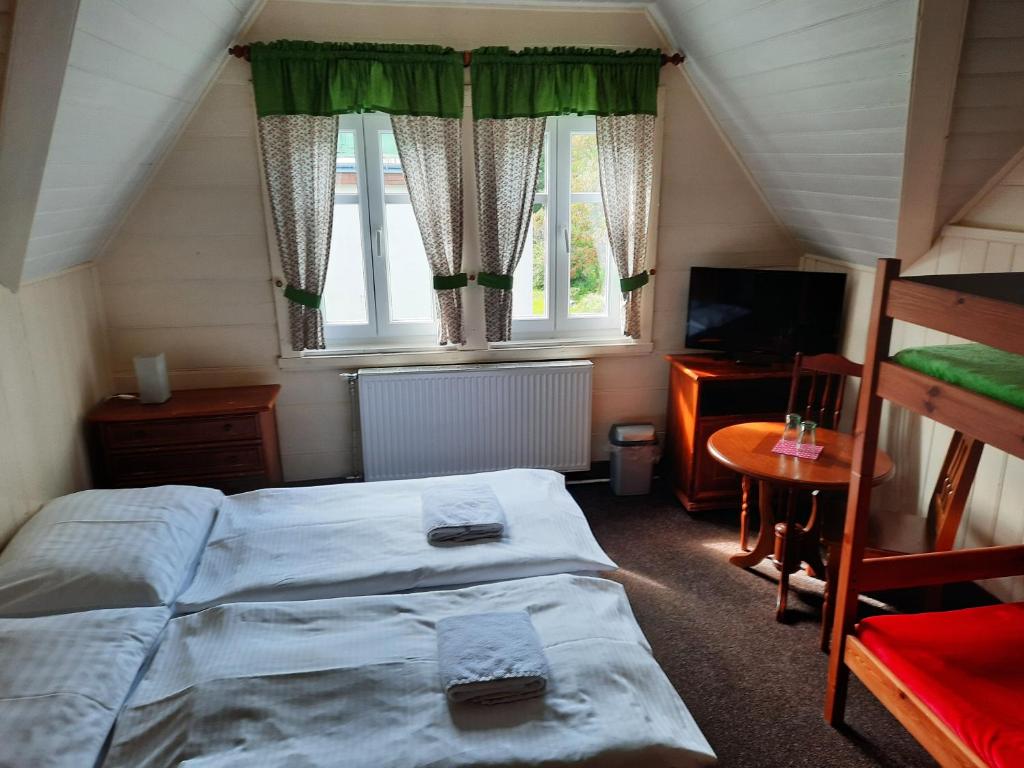 Postel nebo postele na pokoji v ubytování Hotel Diana