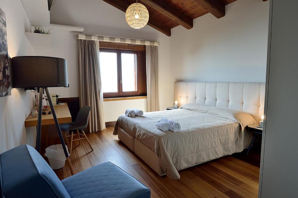 Postel nebo postele na pokoji v ubytování Casa Realia