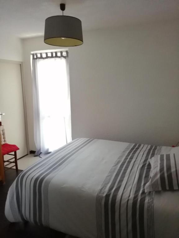 Postel nebo postele na pokoji v ubytování Grand F3 terrasse, vue