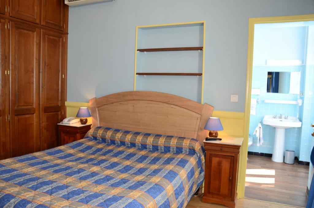 Postel nebo postele na pokoji v ubytování Hôtel Colombet