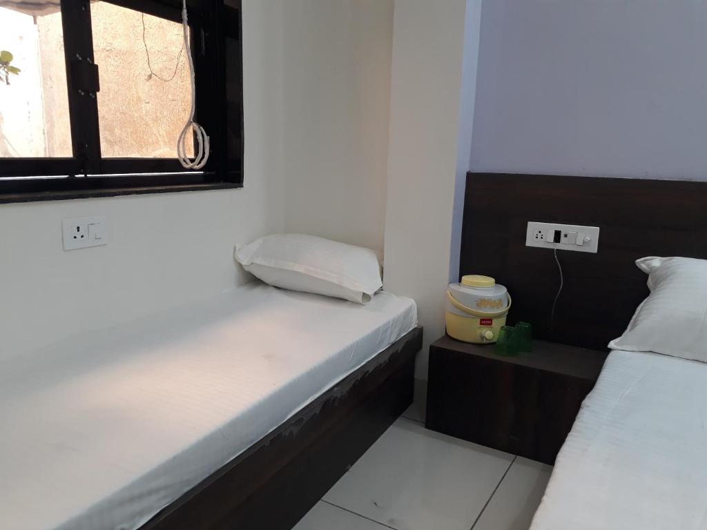 Postel nebo postele na pokoji v ubytování Hotel Chouhan Paradise