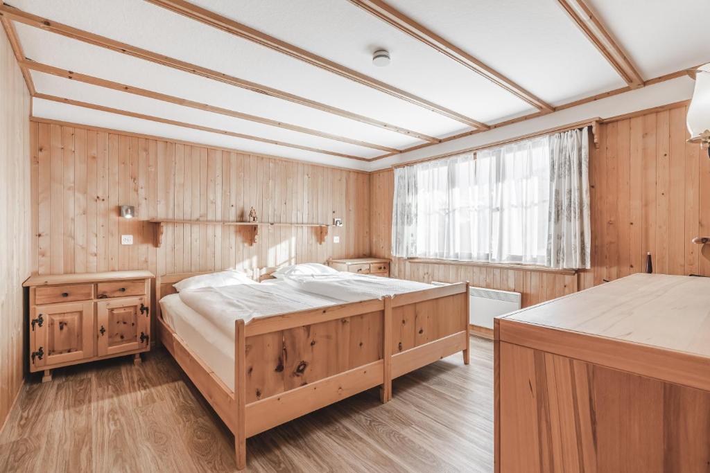 Postel nebo postele na pokoji v ubytování Chalet Sunna Höckli - Pistennah und Ruhig mit Panoramablick