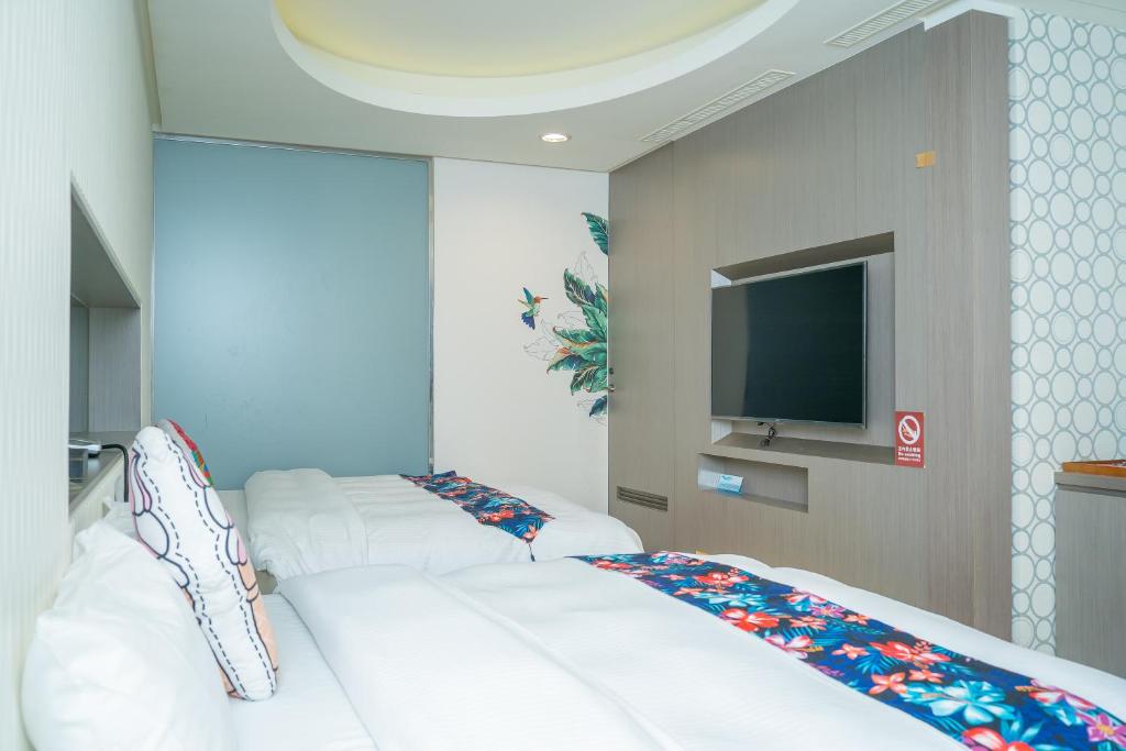 Postel nebo postele na pokoji v ubytování 日月潭天月水色民宿 (老街-停車-度假）skylight bnb