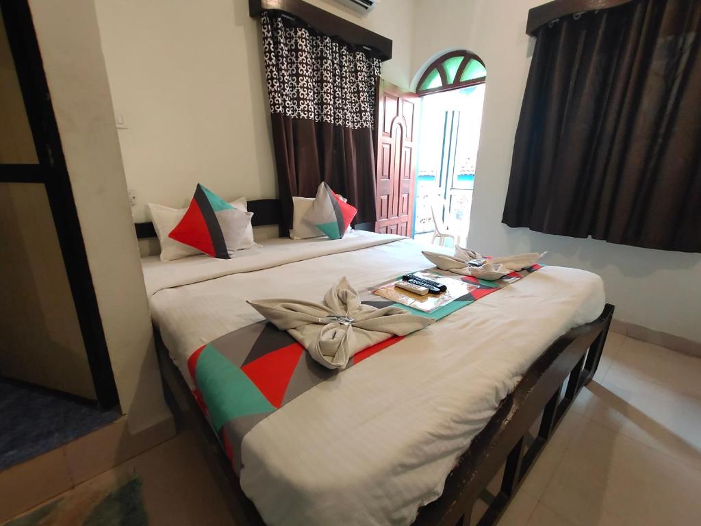 Postel nebo postele na pokoji v ubytování RJ14 Accommodations at Baga Beach