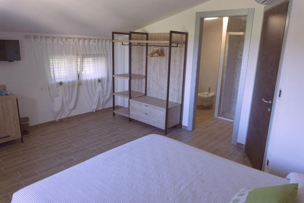 Postel nebo postele na pokoji v ubytování B&B Tra Gli Ulivi