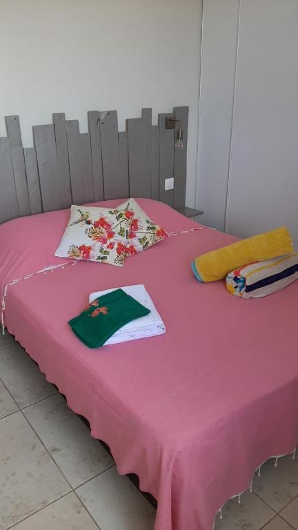 Postel nebo postele na pokoji v ubytování La douceur du lagon