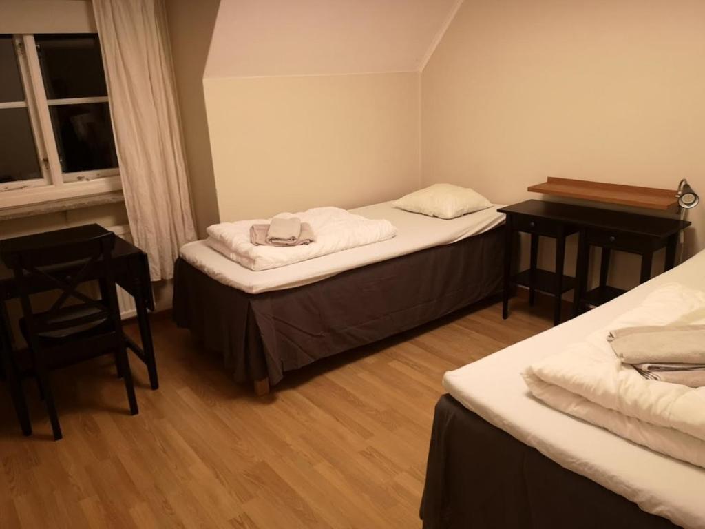 Postel nebo postele na pokoji v ubytování Wisby Trossen 4 AB