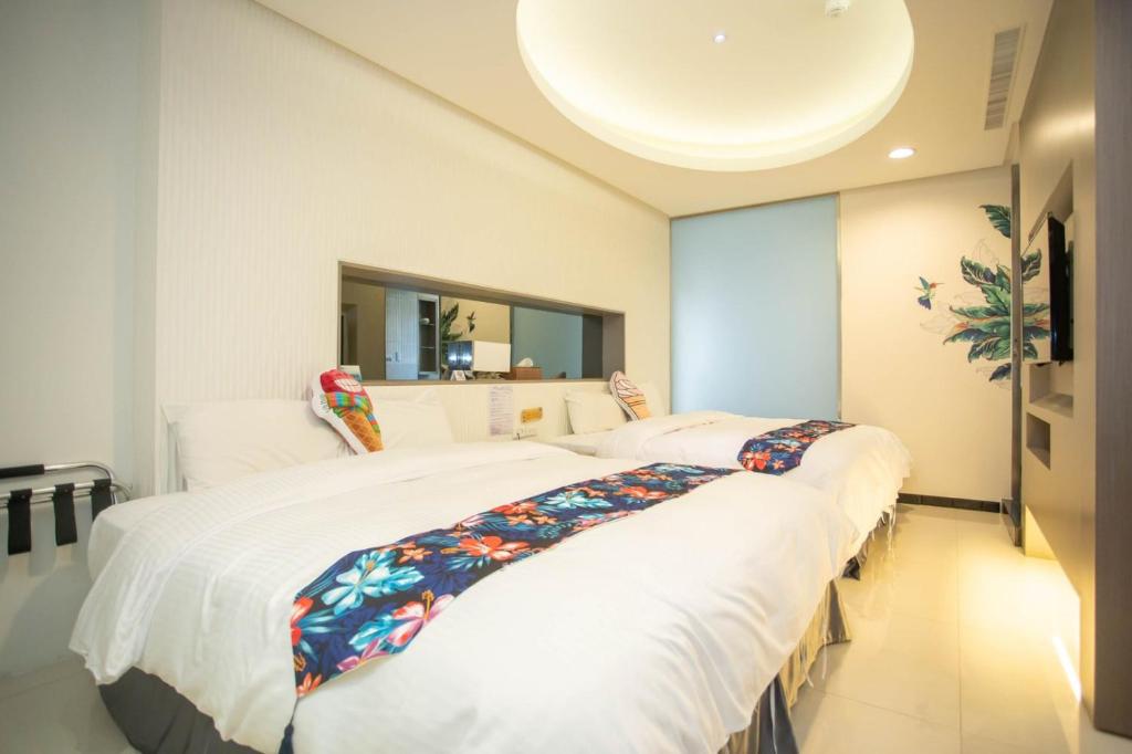 Postel nebo postele na pokoji v ubytování 日月潭天月水色民宿 (老街-停車-度假）skylight bnb