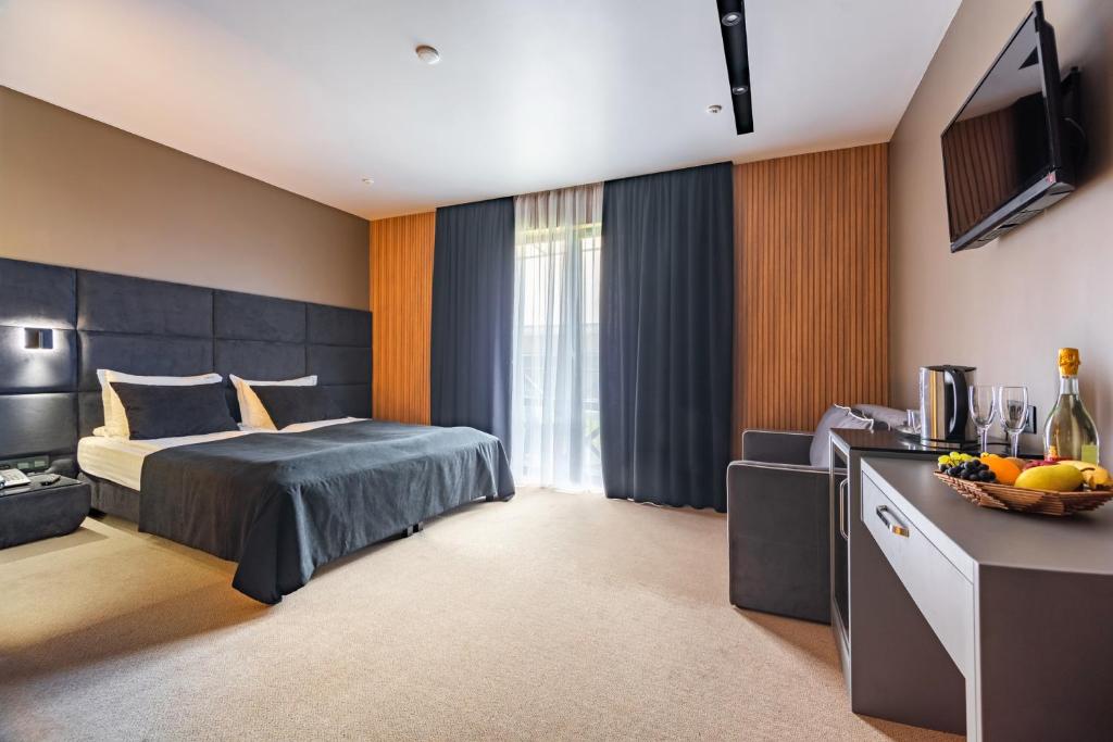 Postel nebo postele na pokoji v ubytování MK Resort (ex. Magiya Karpat)