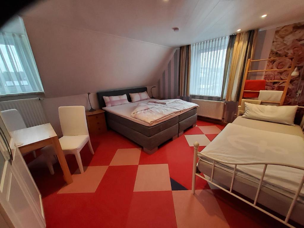 Postel nebo postele na pokoji v ubytování B & B Gästehaus Schmidt