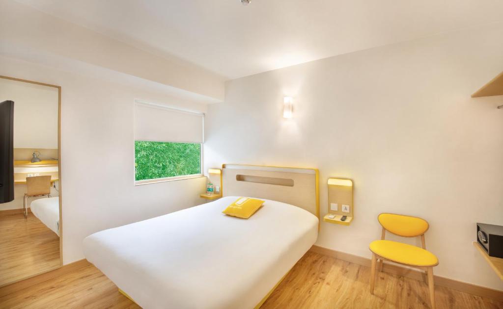 Cama o camas de una habitación en bloomrooms @ Janpath