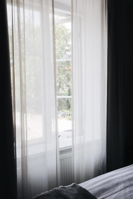 Postel nebo postele na pokoji v ubytování Kalk Hotel