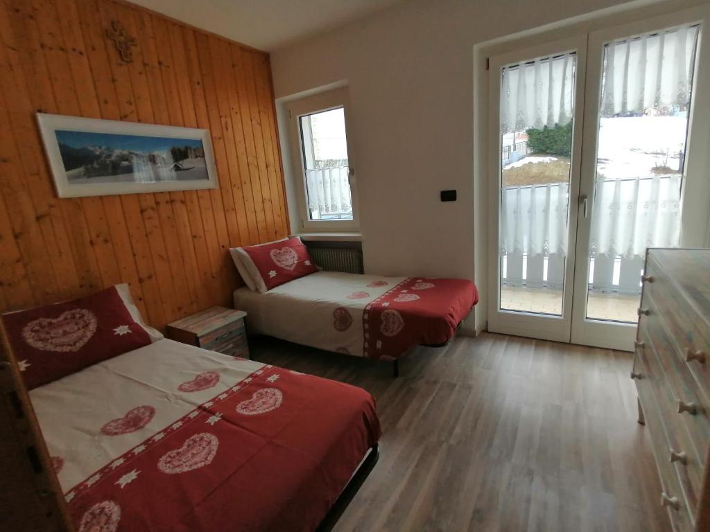 Postel nebo postele na pokoji v ubytování Apartments Giovannini