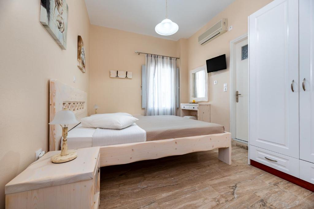 Postel nebo postele na pokoji v ubytování Villa Aegeon