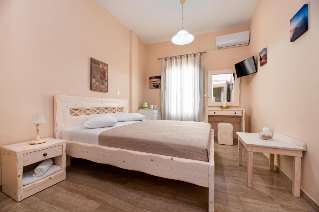 Postel nebo postele na pokoji v ubytování Villa Aegeon