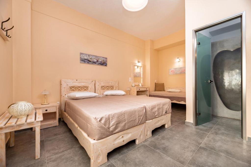 Postel nebo postele na pokoji v ubytování Villa Aegeon