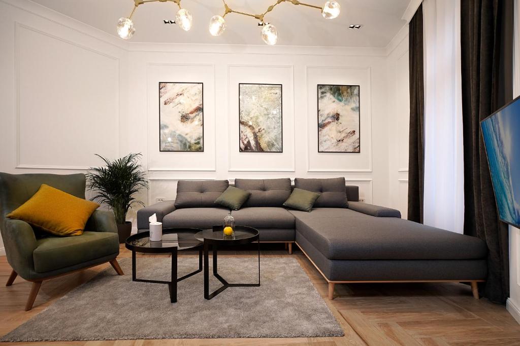 a living room with a couch and a table at Luxury Apartments Donostia & Iruña in Belgrade