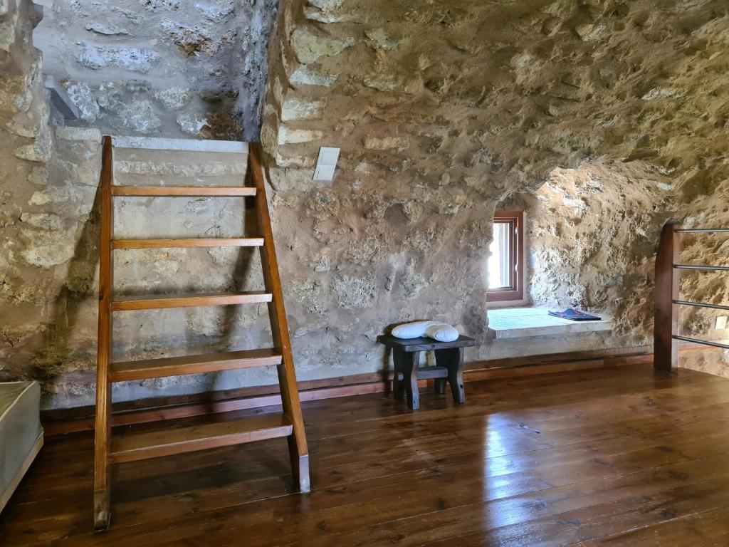 Postel nebo postele na pokoji v ubytování Pyrgos 1869